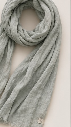 The Gray Hour Linen UPF Scarf laid out, showing fringed edges